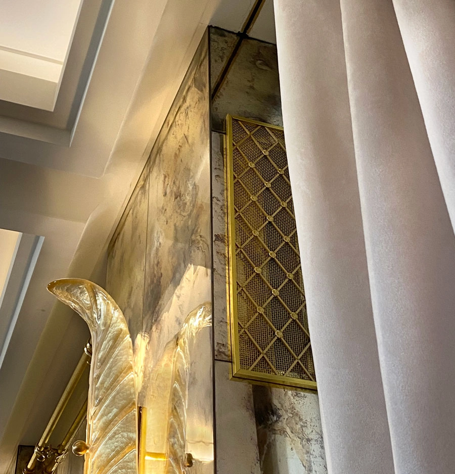 Brass Regency Diamond grille inserts for walls and window seat.