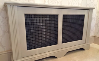 Renovating a large Manor House, radiator covers with interwoven grilles.