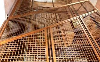 Hand made decorative mesh lift shaft guard