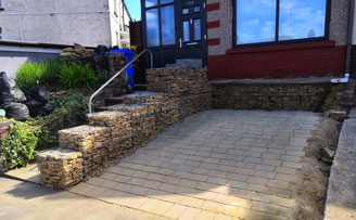 Creating an in front of house parking space with gabion baskets