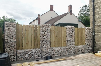 Timber & gabion boundary fence Timber & gabion boundary fence